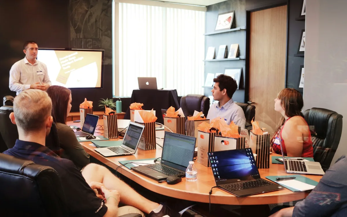 A team in a training session around a boardroom table
